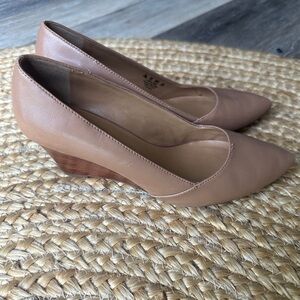 Used and well worn women’s Franco Sarto high heel wedge pumps, size 7.5